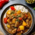 Authentisches Jamaikanisches Curry-Hühnchen mit Kokoscreme 41 Sure, please provide the text you would like translated from Authentic Jamaican to Deutsch.